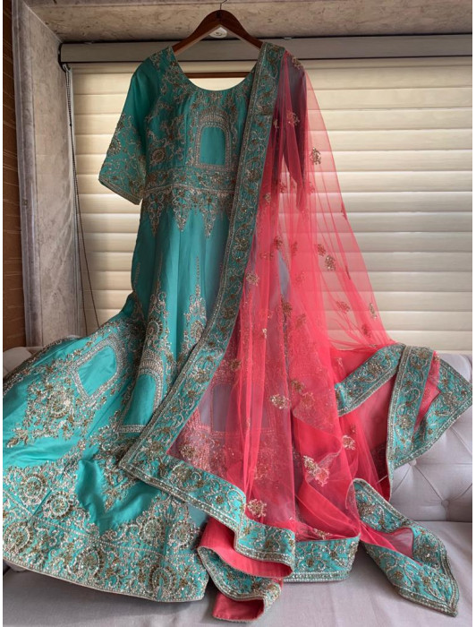 Turquoise blue silk gown with oriental embroidery and sequins