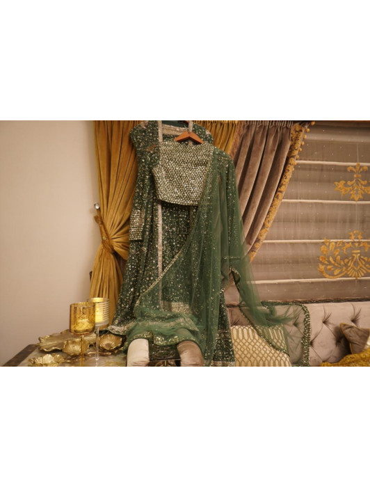 Basil net  silver sequins lehanga paired with jacket blouse and dupatta