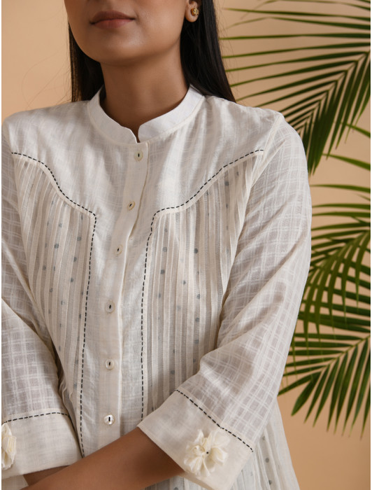 A chanderi and khadi pintuck shirt with front placket, 3/4th sleeves, comes with a soft cotton matching slip