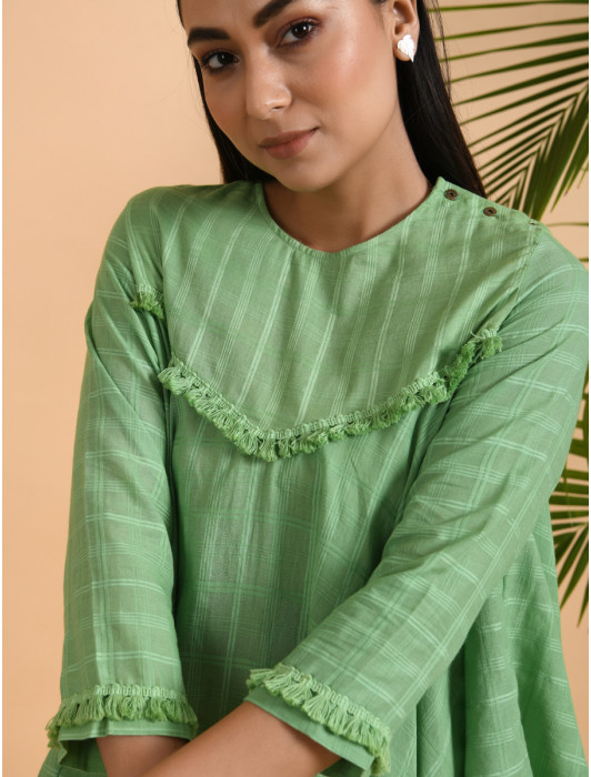 A asymmetrical top with 3/4th sleeves and yoke decorated with soft cotton tassel lace