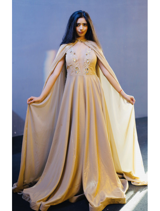 Golden  hand  embroidered  gown  with  a cape